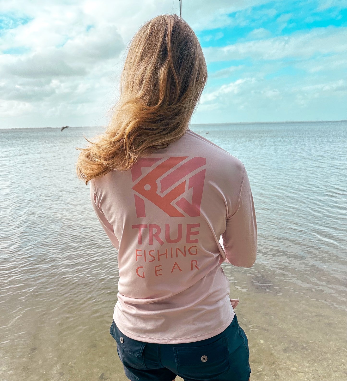 Back view of lightweight UPF shirt for female anglers