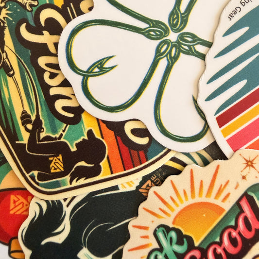 Collection of colorful stickers with various designs, including fishing-themed graphics.