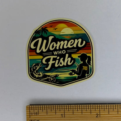 Sticker with 'Women Who Fish' design on a white background with a ruler for scale.